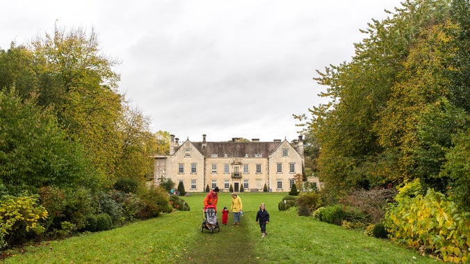 Visitors and the south front of the house at Nunnington Hall, North Yorkshire